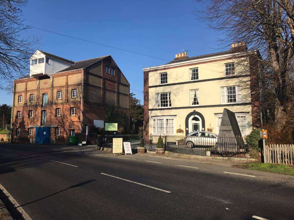 The old water mill and the hotel side by side on Langford's main road