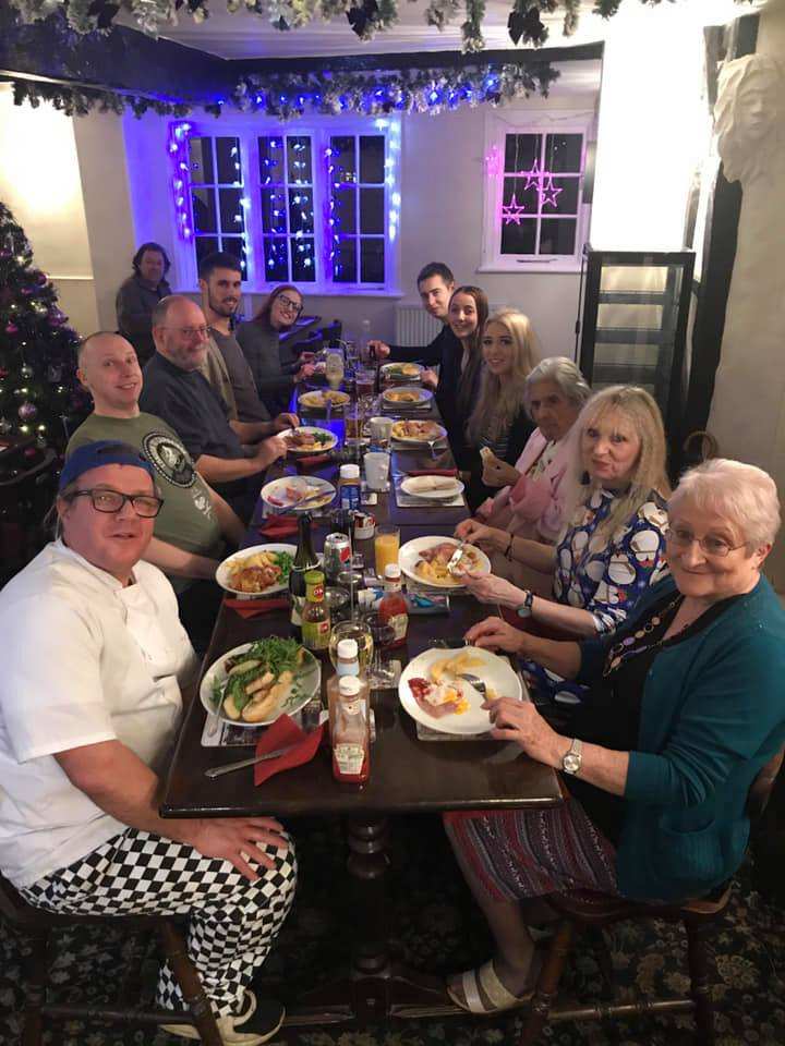 A table of diners enjoying a meal inside the hotel