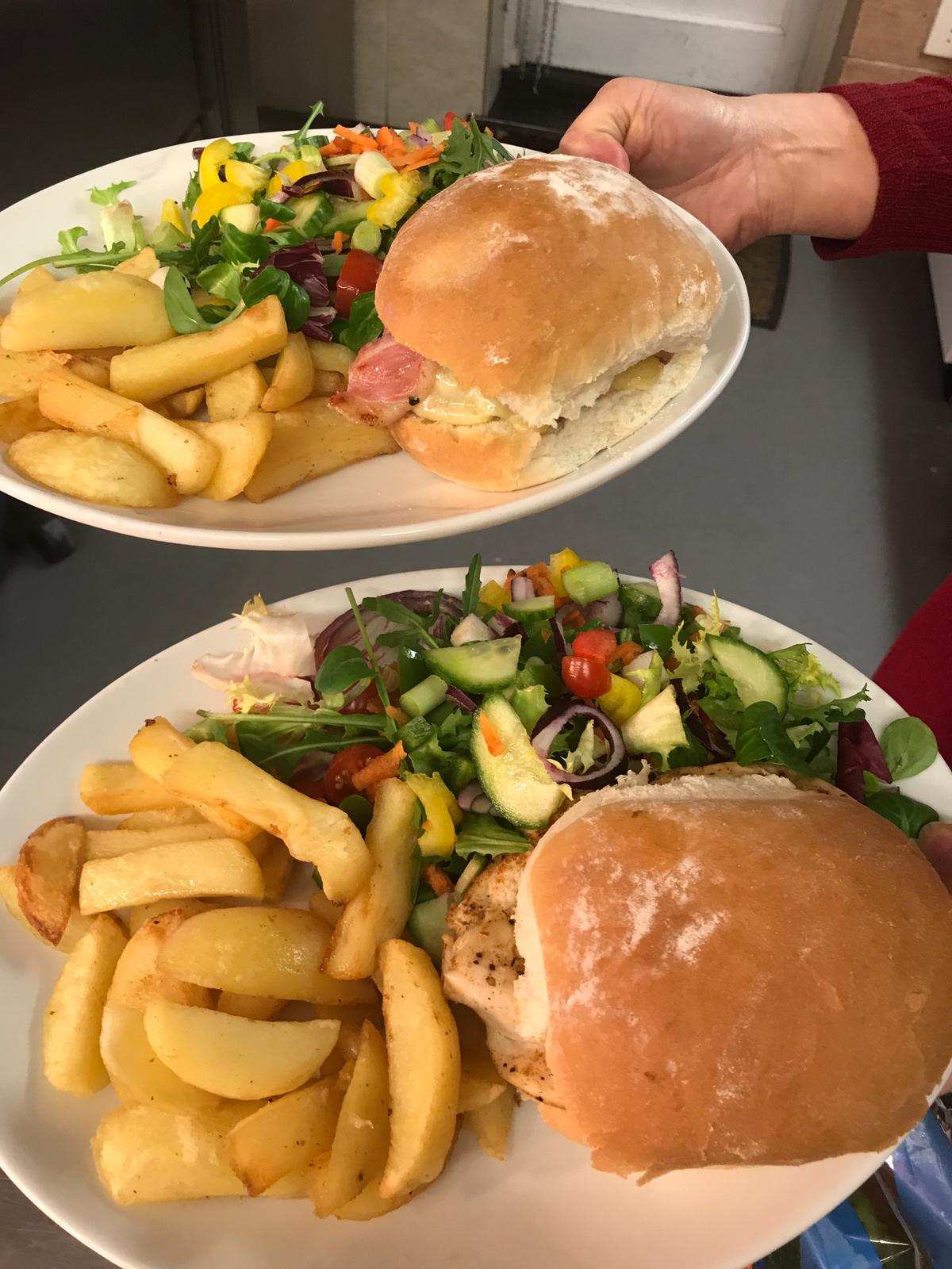 An egg and bacon burger and a Cajun chicken burger