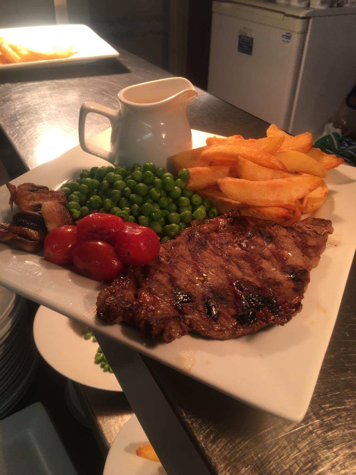 Steak with peppercorn sauce