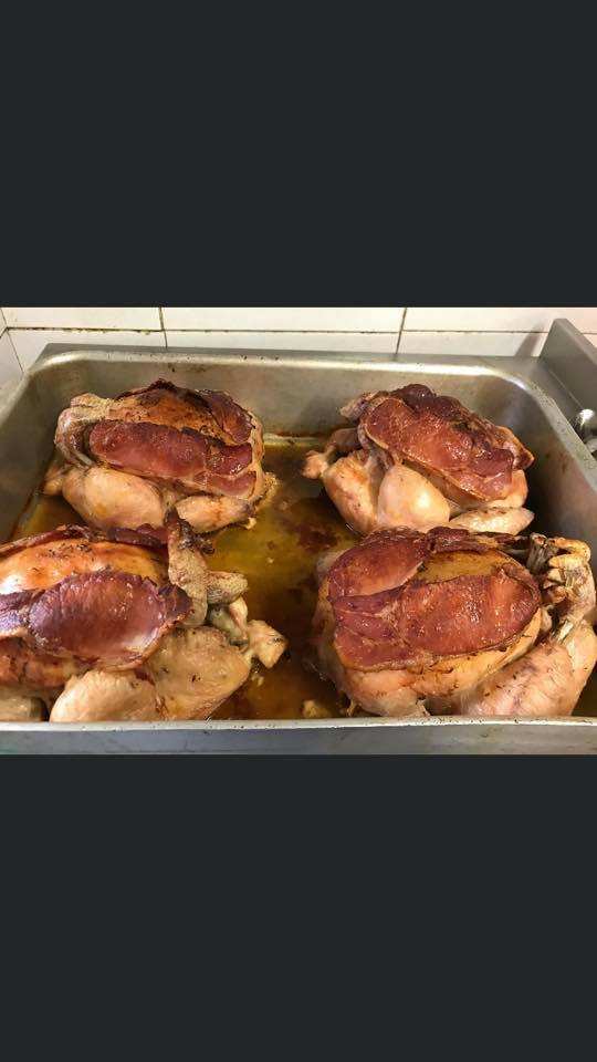Roast chickens in a tray