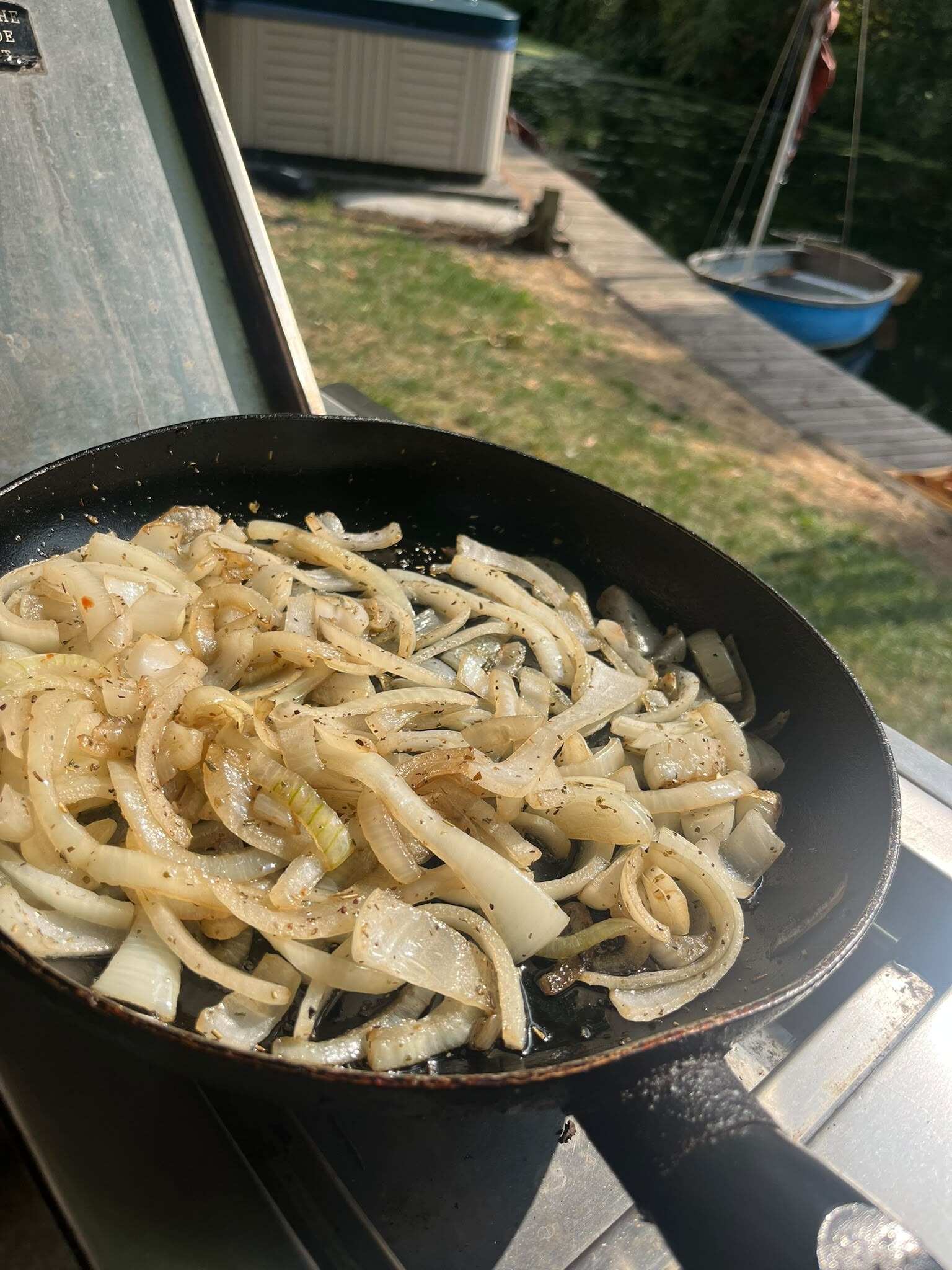 Fried onions on the grill beside the river