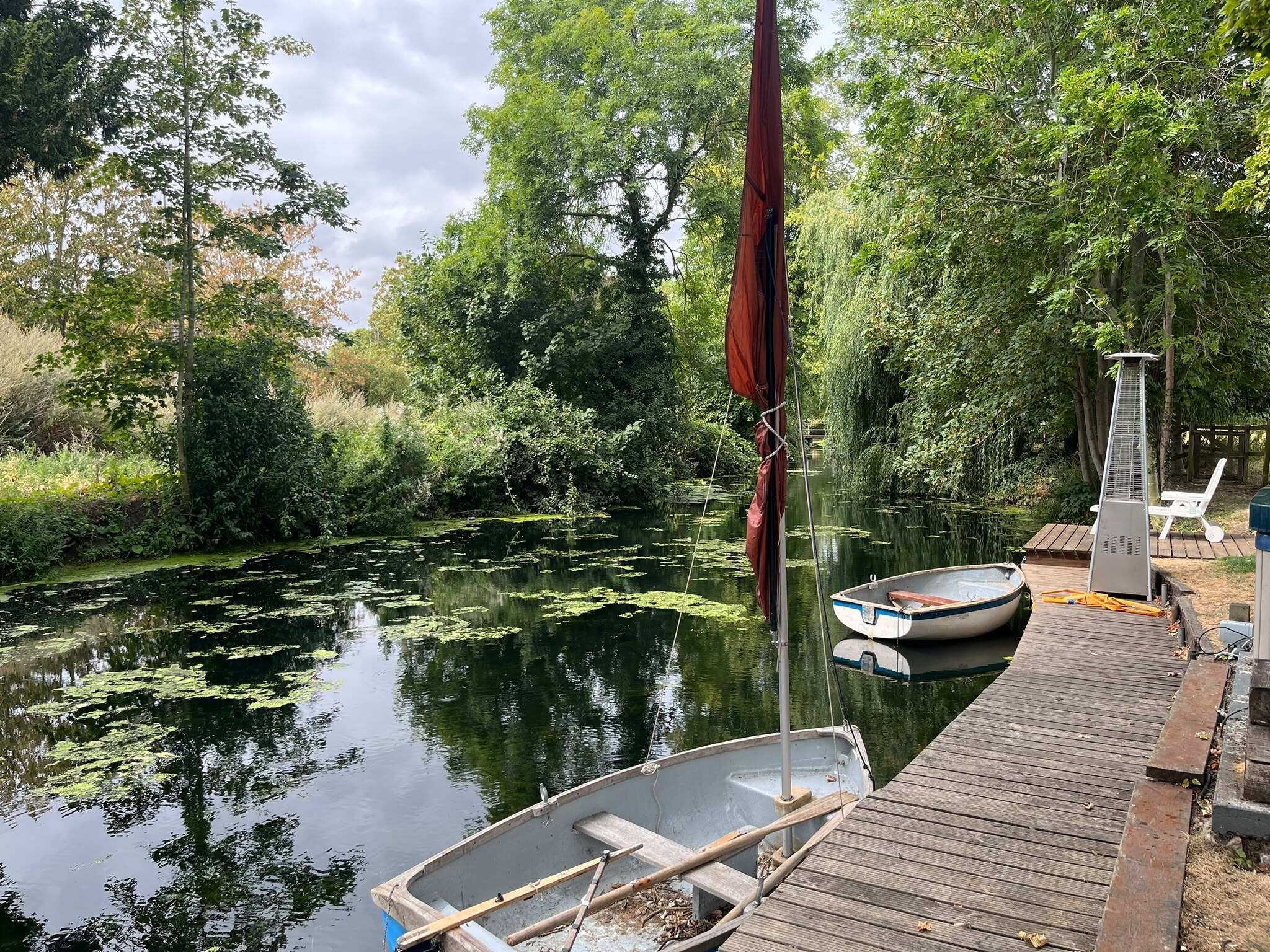 Rowing boats moored at the wooden jetty