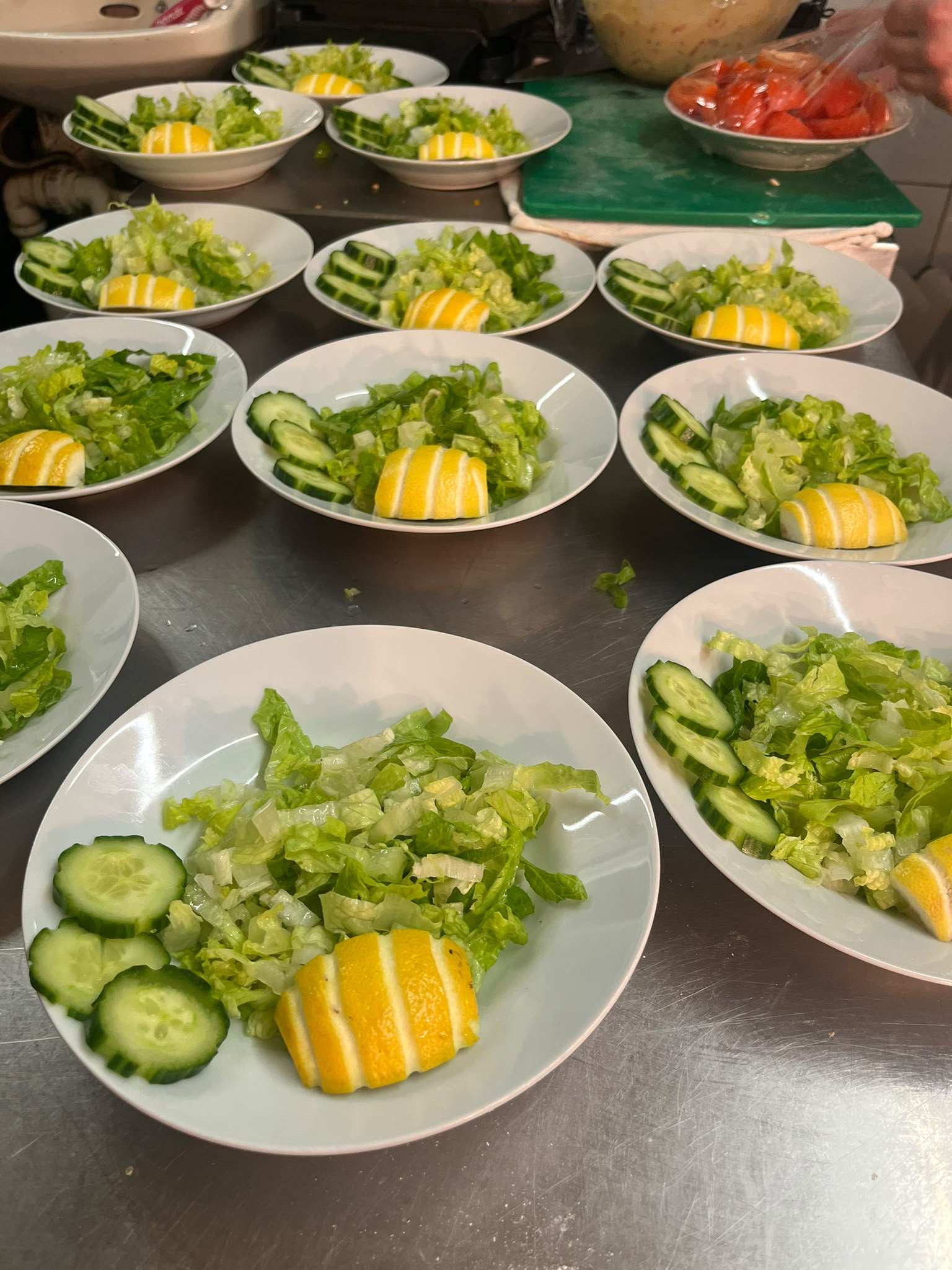 Plates of salad laid out ready for a party